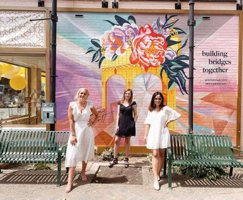 Mural on the exterior of the Kendra Scott store on Walnut street. The Build Bridges Together mural is by Artist Ashley Hodder.