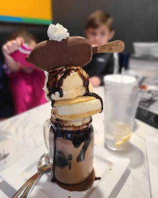 Trio shake with chocolate. Ice cream sandwich, ice cream scoop, and ice cream bar.