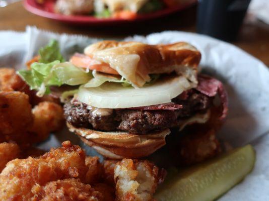 Fitz's burger - 1/2 lb  burger, corned beef, swiss cheese, and thousand island dressing.