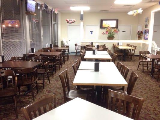 Inside the dining room. Front door is to the left, pool/foosball table back to the right.