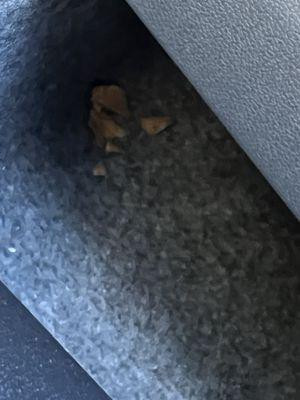 Bunch of leaves and trash under seat after the "vacuumed"