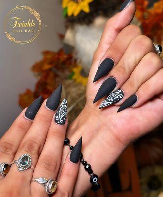 Dark dreams and spooky nights. Let your nails channel the mystery of Halloween with this bold black design!