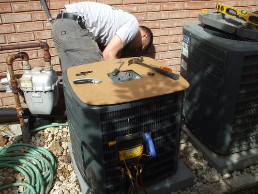 Our tech installs the new outdoor unit.