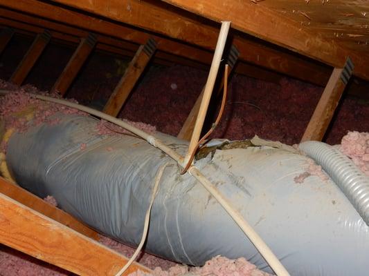 Ripped and damaged insulation cover for HVAC duct