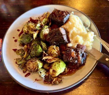 Absolutely delicious Bison Shortribs, slow cooked in red wine reduction -- melts in your mouth!