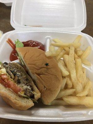 Mushroom Swiss burger with a fried egg and fries