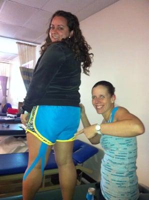 Michelle kinesio taping Jess' hamstrings... have YOU seen all the kinesio tape in the Olympics 2012?!?