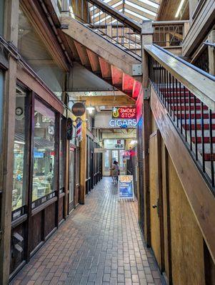 Outside. Taneda has a non-descript storefront and entrance located inside a two-story brick building with Smoke Stop.