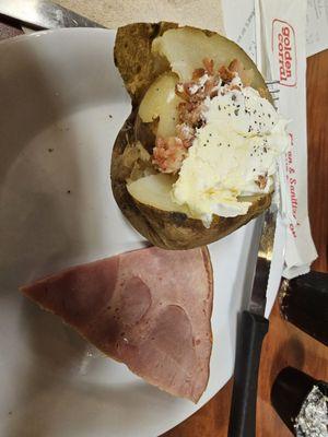 Slice of ham with baked potato