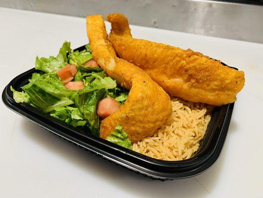 Fish over rice and salad