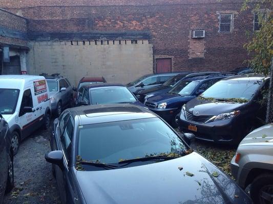 All these cars have to be moved to get just one car out of the back garage building.  It easily takes an hour.