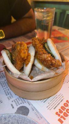 Seoul Hot Chicken Baos    24-hour brined chicken thigh, deep-fried and sauced in garlic gochujang. Topped with a spicy house-made pickle.