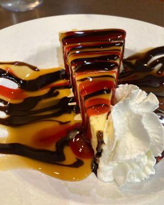 Cheesecake with caramel and chocolate drizzle