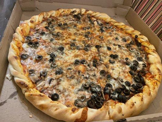 Hand rolled pizza with mushrooms and olives - so good!