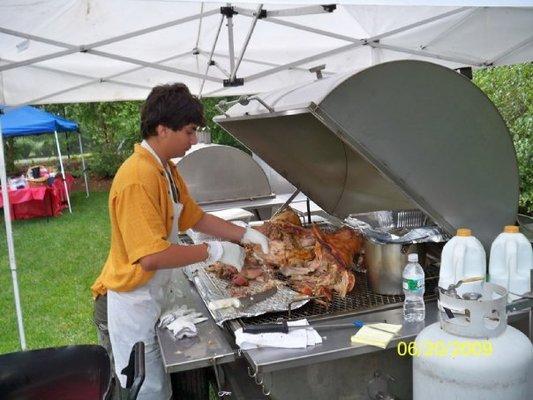 My son learning to cut the Pig. He's come a long way, since then.