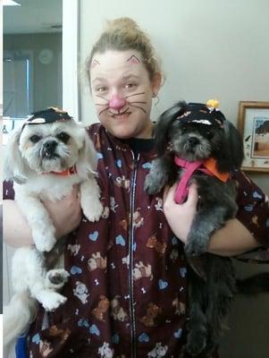 Groomer Amber having some Halloween fun with a couple of her puppy friends