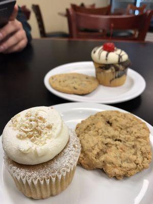 Banana cupcake and butterscotch cookie with marble cupcake and peanut butter chunk cookie in background