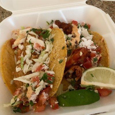 Fish taco on the left and shrimp taco on the right