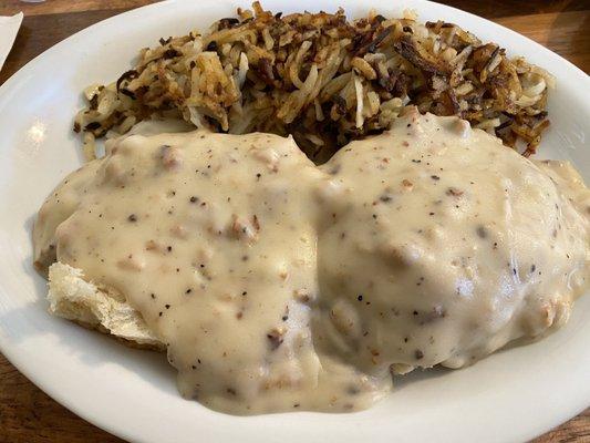 Half biscuit and gravy with hash brown. It's half but still huge portion.