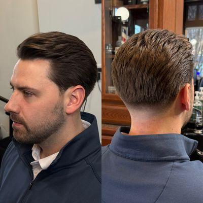 Mid length haircut with skin tapper on back of neck, done by our Barber Stylist Morgan.