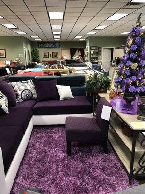 Are you Bold enough to own this??? Dreamy purple sectional sofa comes with all the pillows. Mention Yelp and I'll throw in the rug for free!