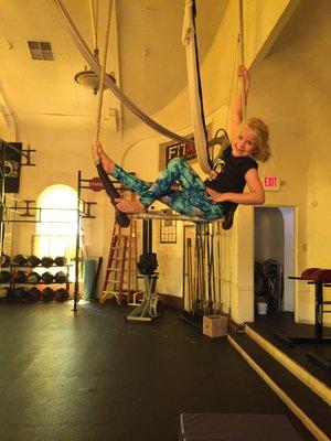 aerial youth student Sophia looking so darn cute on the trapeze during a private aerial lesson at 3 Queens Circus!