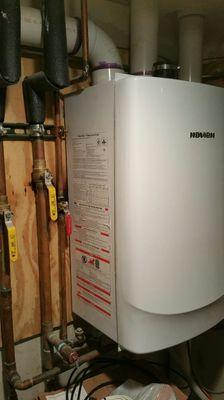 Tankless high efficiency hot water heater.