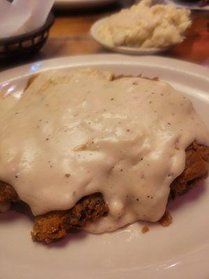 Country fried steak with mash in the background (a bit heavy on the gravy. Ask for it on the side)