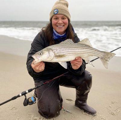 Looking to fish the beaches of LBI NJ? Fishermans Headquarters has all of the essentials for surf fishing. Here's Sloane with a LBI bass.