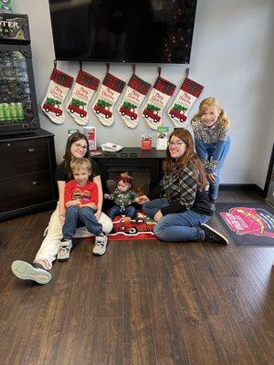 One of the Owner's family in front of the "Fireplace" and stockings! Happy Holidays from the Martins!