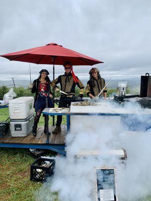 Salty Bottom Oyster crew grilling up some grilled oysters!