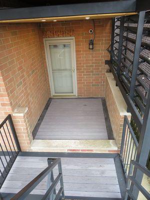 Side deck with custom louvers and composite decking with picture frame