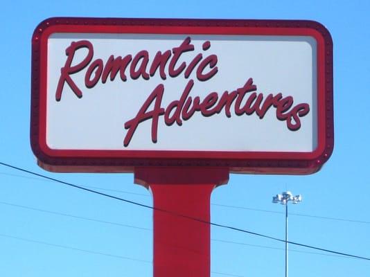 Romantic Adventures sign by daylight