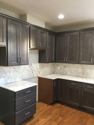 I am a personal fan of darker cabinets. I especially like the drawer pulls this homeowner chose.