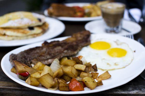 Steak & eggs (blueberry buttermilk ricotta pancakes w/ lemon curd in the background)