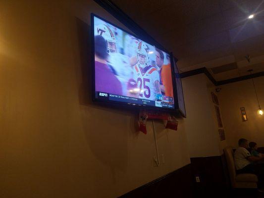 Nice tv set up to watch sports games.