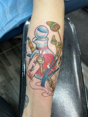 Neo traditional Alice and wonderland themed tattoo.