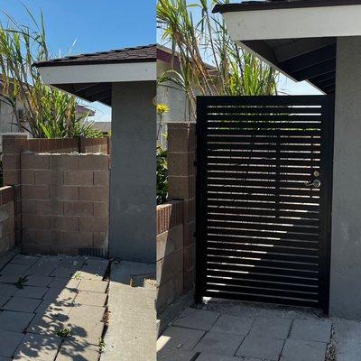 Wall removal with new modern gate installation