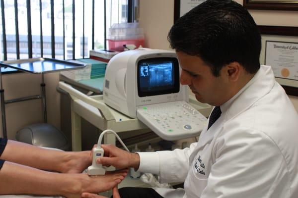 Dr. Hassid Performing an Ultrasound