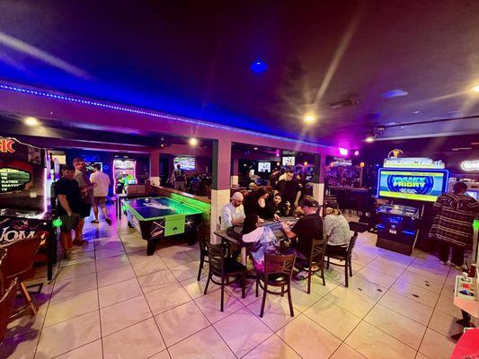 Back room with loads of games and additional bar. Can be used for private parties as well.