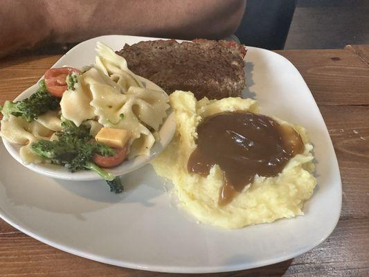 Meatloaf special with 2 sides: mashed potatoes and gravy and pine club salad.