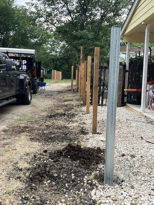 Horizontal Fence Install. Posts first