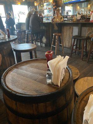 Barrels for tables, stools for seating.