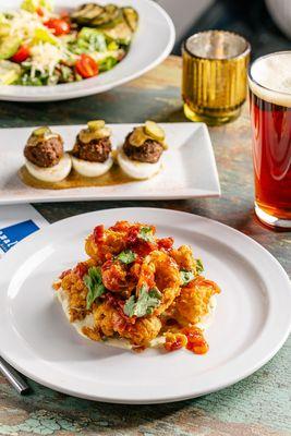 Crispy fried calamari, beef deviled eggs, beer, and a salad