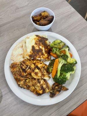 Grilled Chicken Breast with sides of plantains, chicken lasagna & vegetables