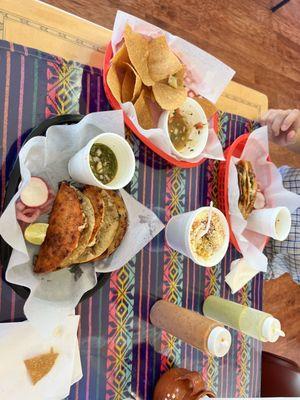 Birria tacos, corn in the cup and pico de gallo with chipa