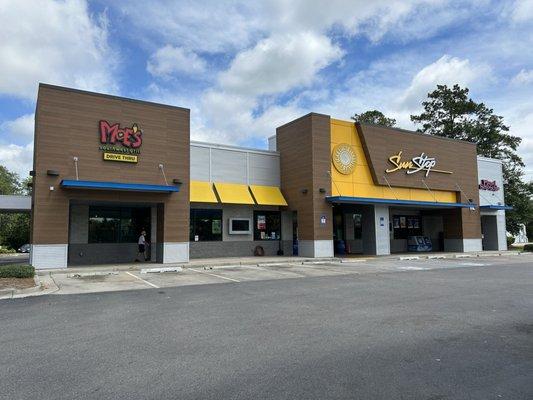 Road view of shops.