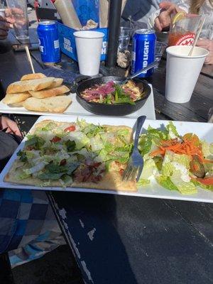 Jalapeño artichoke dip (back) and daily flatbread