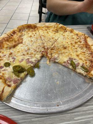 Their cheese pizza with half ham, pineapple and jalapeños.