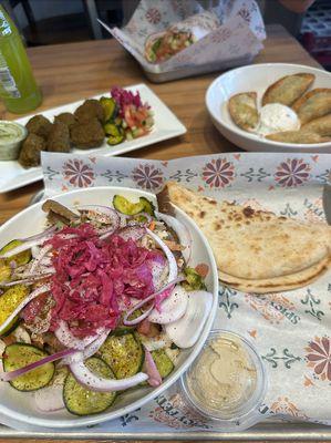 Mediterranean bowl, falafel, and samosas.